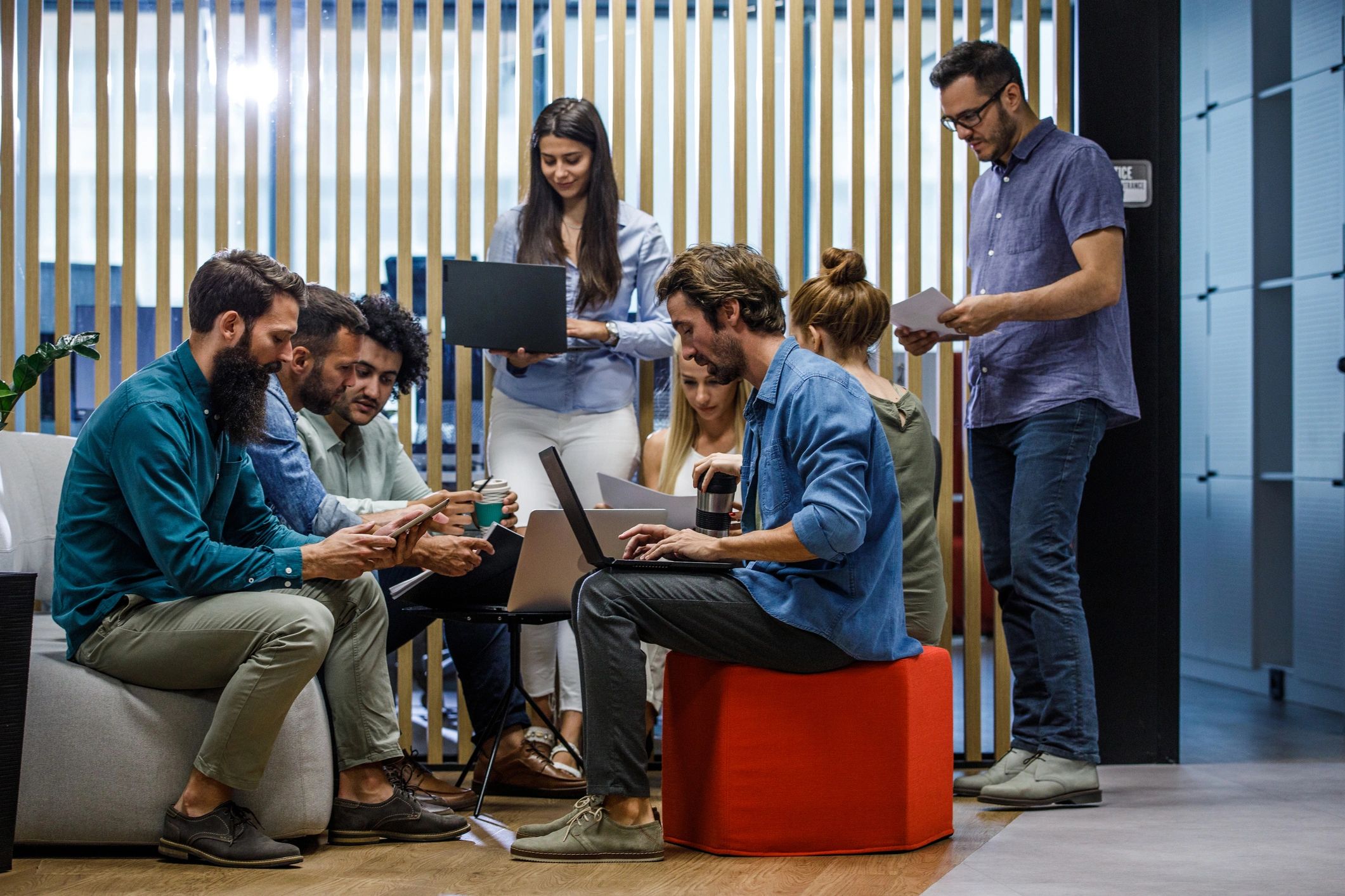 Dhansu Team collaborating in a modern office